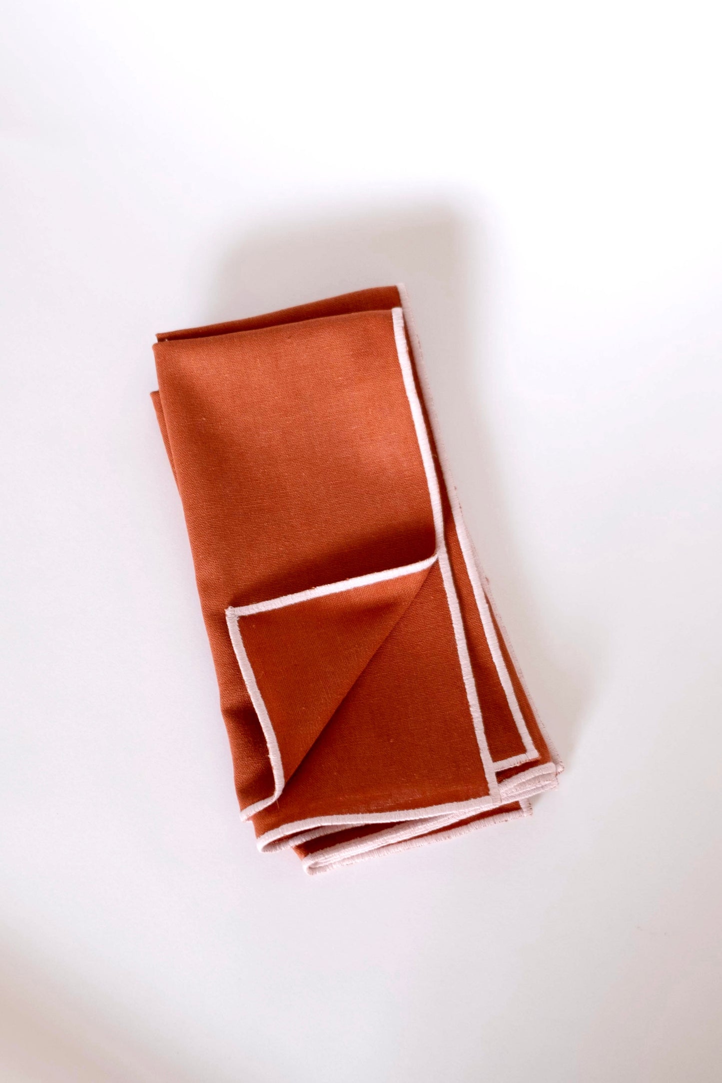 Line Napkin - Rust/Salmon Piping