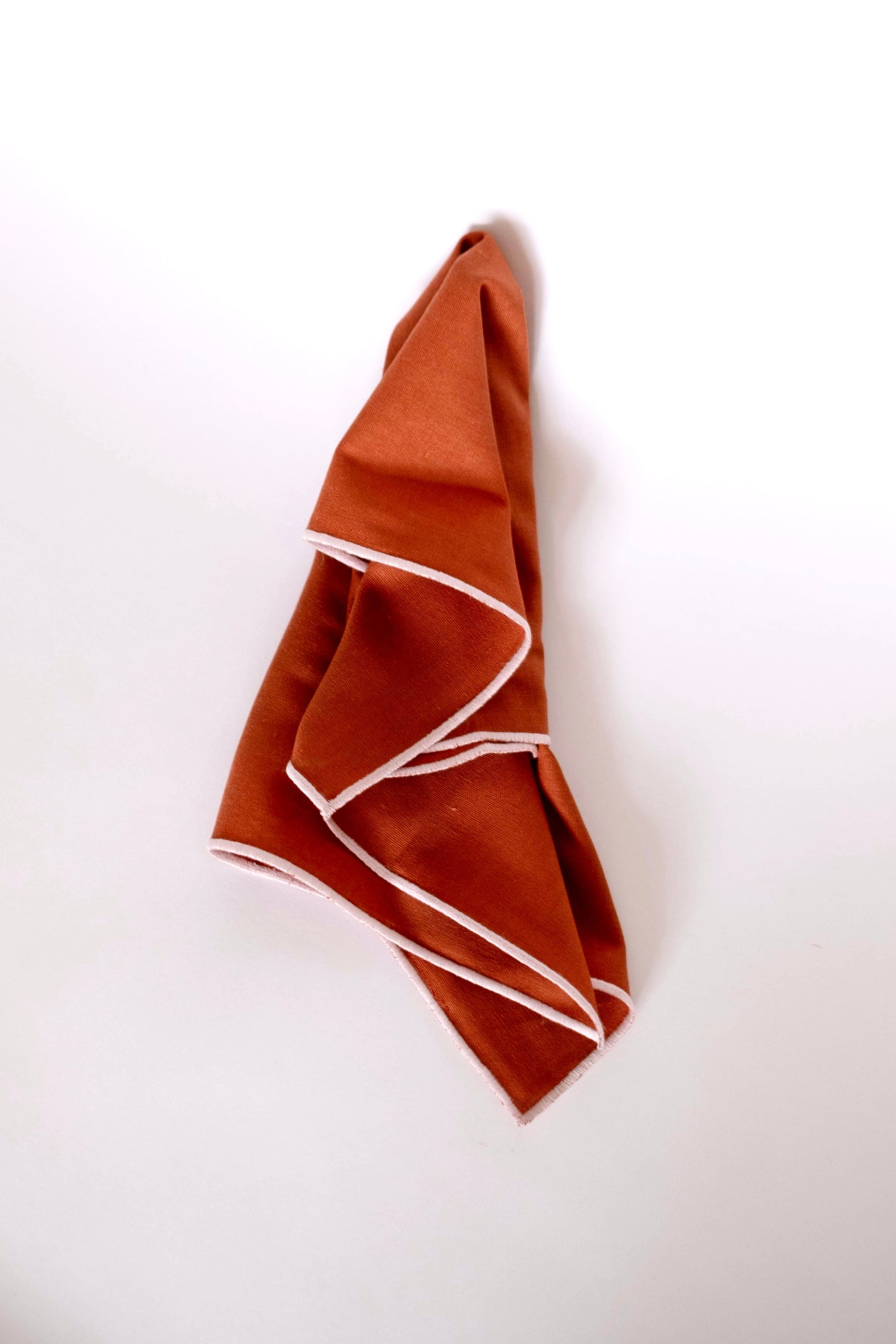 Line Napkin - Rust/Salmon Piping